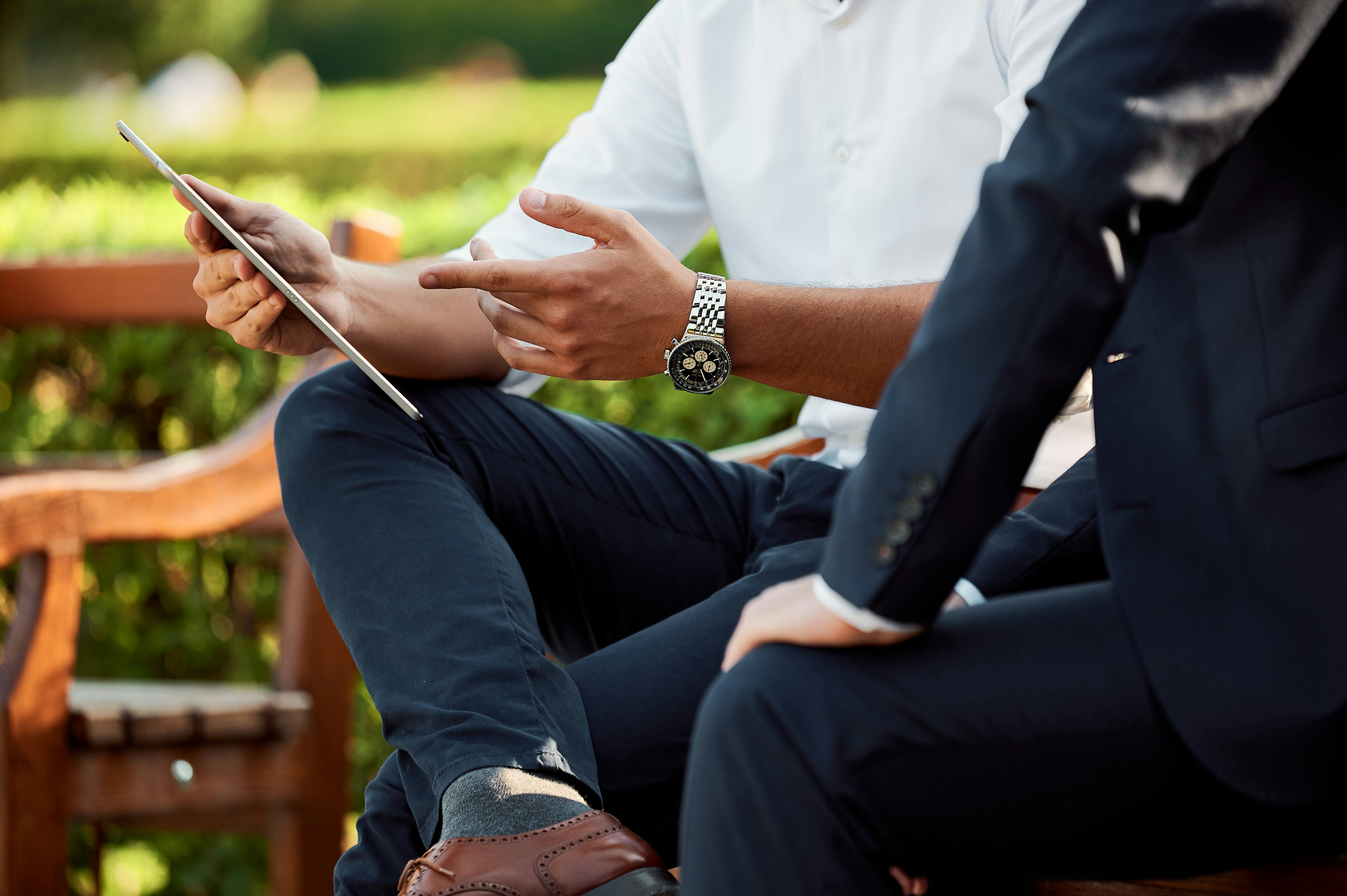 Two business men sitting on a bench